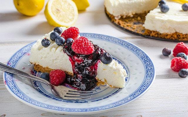 Lemon Cheesecake with Gin-spiked Summer Berry Coulis