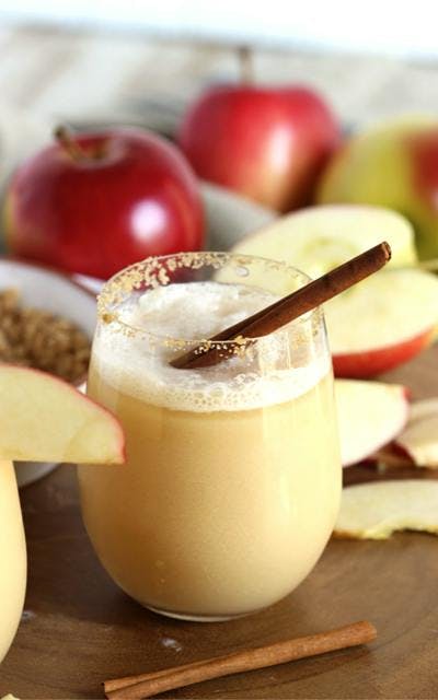 Apple Cider Gin Fizz with cinnamon stick cocktail