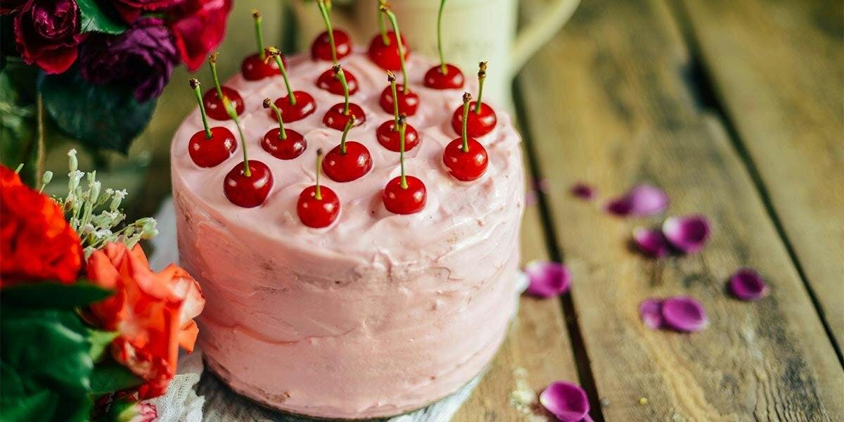 This pink-frosted Cherry Gateau is spiked with gin and Maraschino liqueur! 