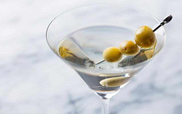A Dirty Martini mixes gin, vermouth and olives. Click on the image to find the full recipe!