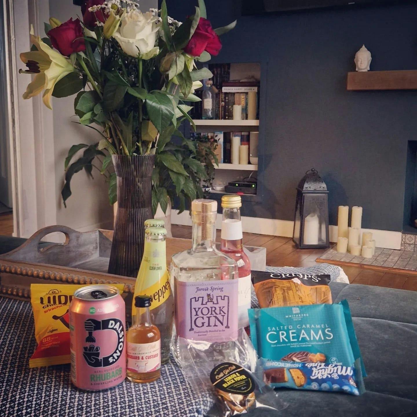NDC Heritage Gin box contents with roses in background