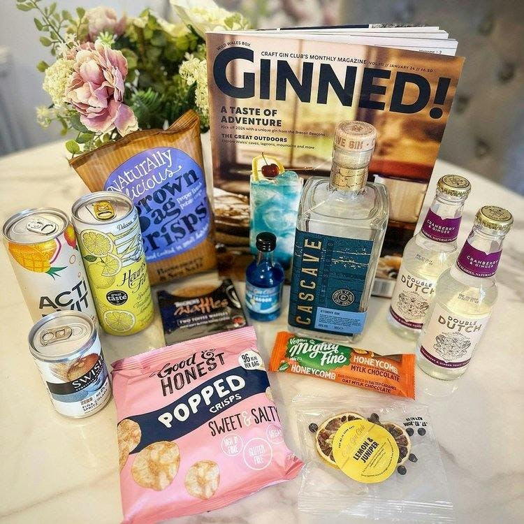Contents of Cascave Gin box with flowers in background by @slimmingworldslimshady