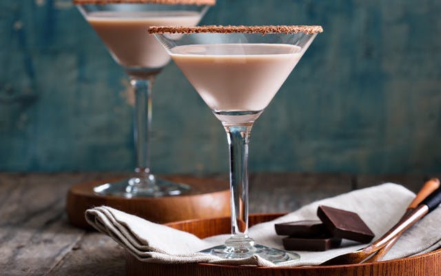 Creamy chocolate cocktail in a martini glass with a chocolate rim