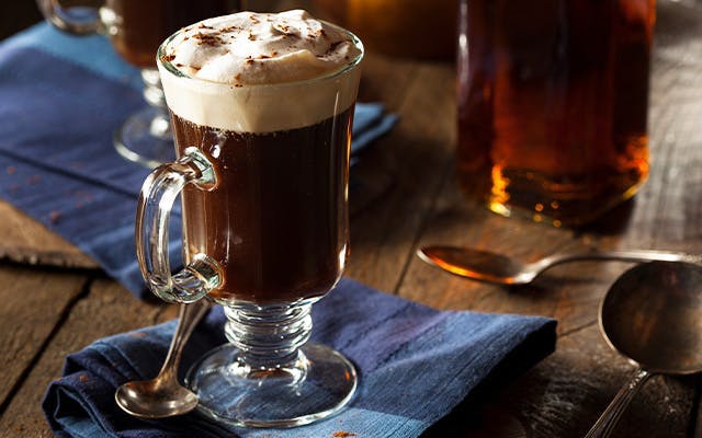Example of an Irish Coffee, with cream floating on top of black coffee