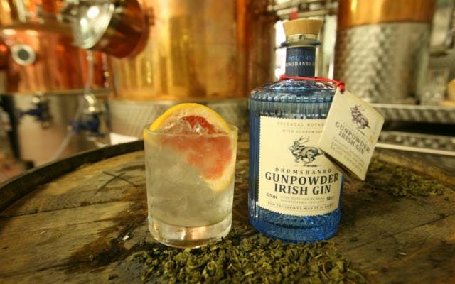 gunpowder drumshando irish gin bottle and gin and tonic with grapefruit wedge
