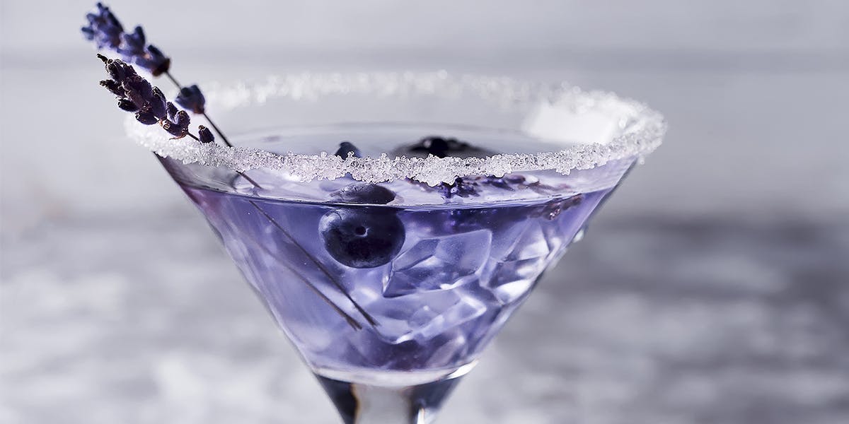 Don't let this pretty purple cocktail's appearance fool you - it packs quite the punch!