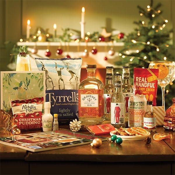 December Gin of the Month box on a table in Christmassy living room