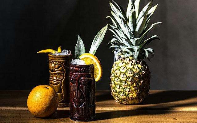 Tiki Cocktail With Pineapple Leaf Garnish