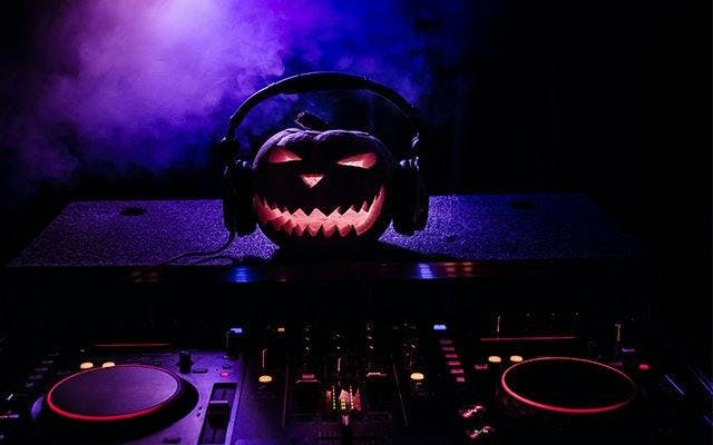 Halloween pumpkin on DJ decks