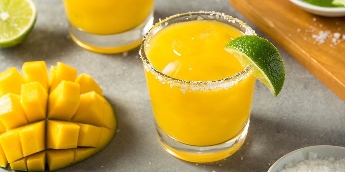 Every sip of this mango, ginger and gin cocktail is brimming with summer joy!  