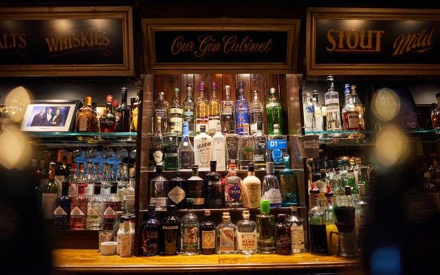 The gin cabinet at the Ship Tavern pub in London