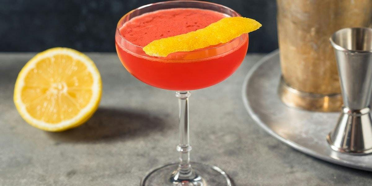 This stunning Aperol & Amaretto Sour is made with gin and Angostura bitters!  