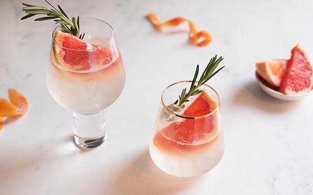 Grapefruit gin with tonic and rosemary garnish