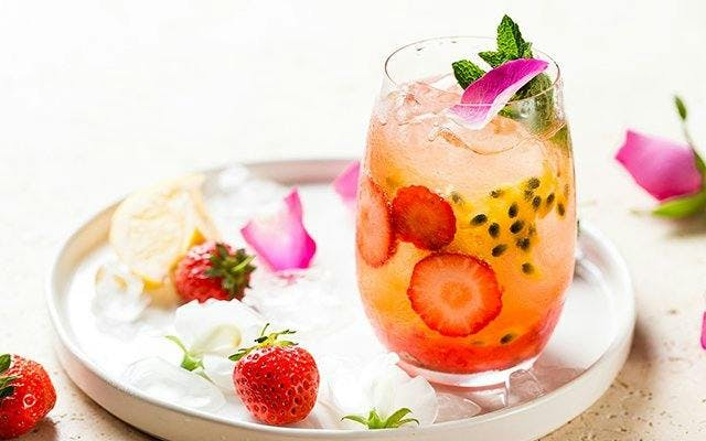 Fruity cocktail with passion fruit and strawberry