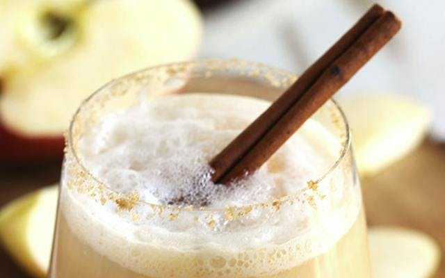 Apple Cider Gin Fizz with cinnamon cocktail