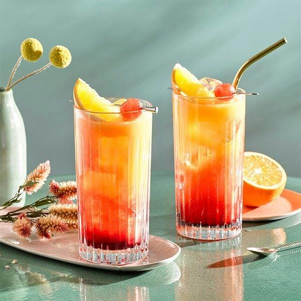 Gin sunrise cocktail with orange garnish