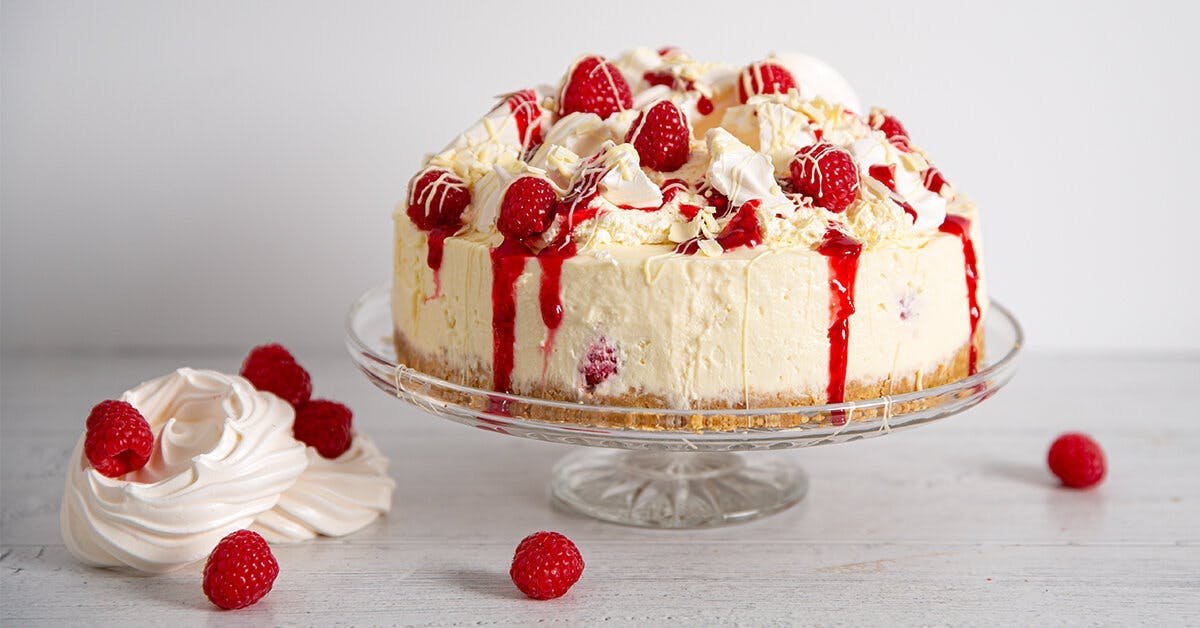 This Eton Mess Cheesecake recipe is made with gin, raspberries and white chocolate!