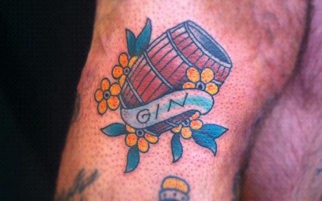 Barrel of gin and flowers tattoo