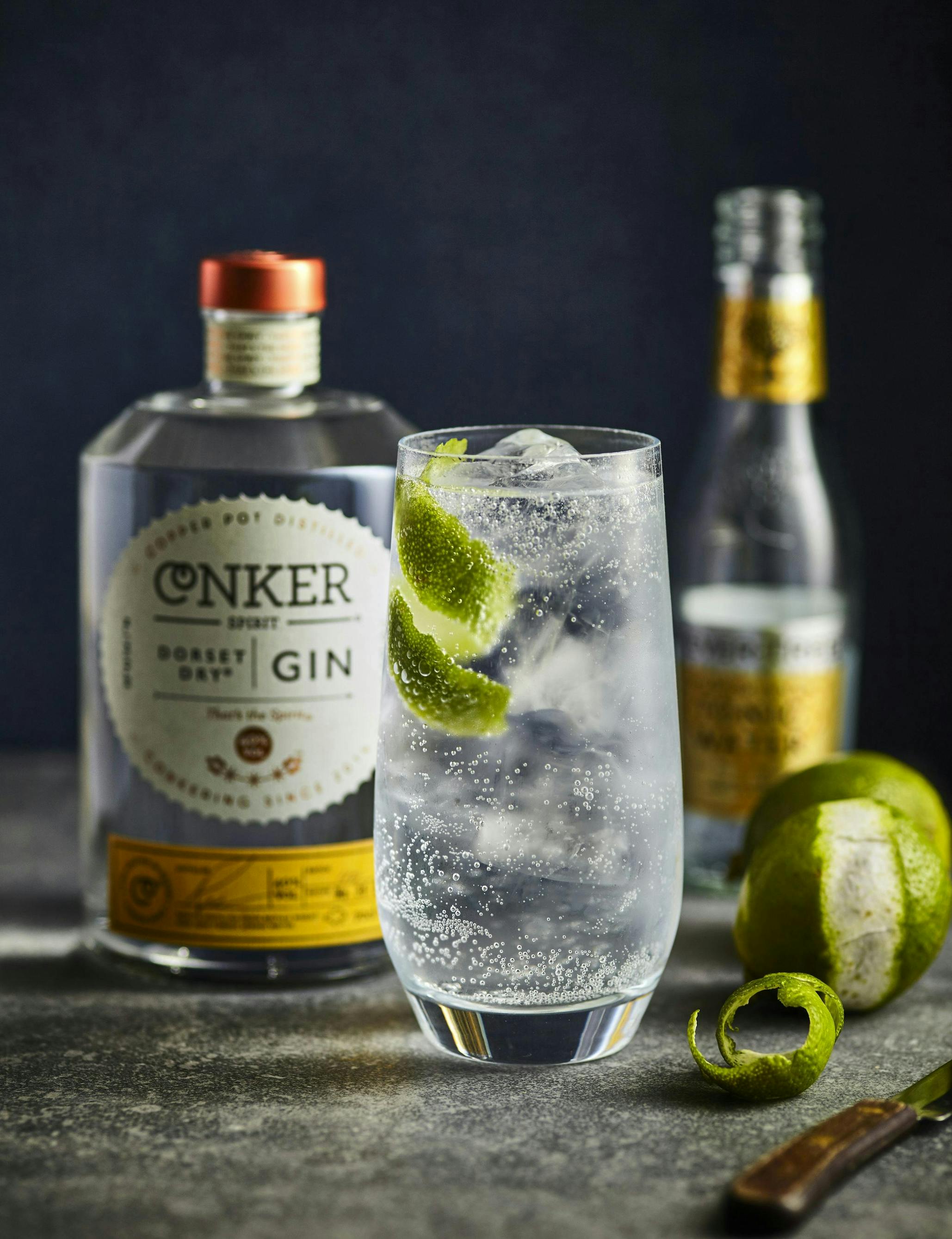 conker gin and tonic with lime peel twist garnish