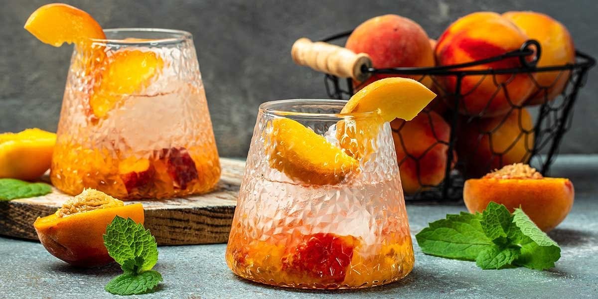 This fabulous Peach Gin Spritz mixes gin with peach schnapps and prosecco! 