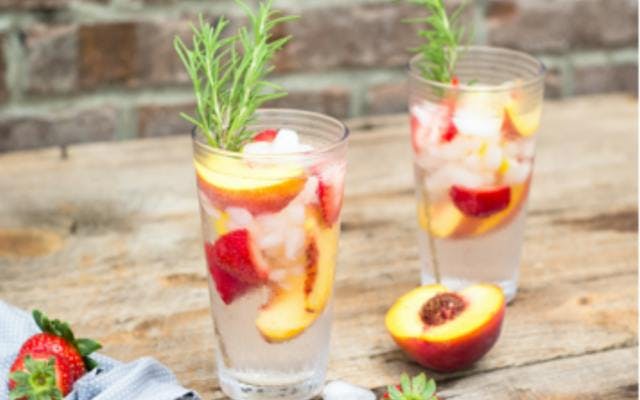 Gin and tonic with peach and rosemary