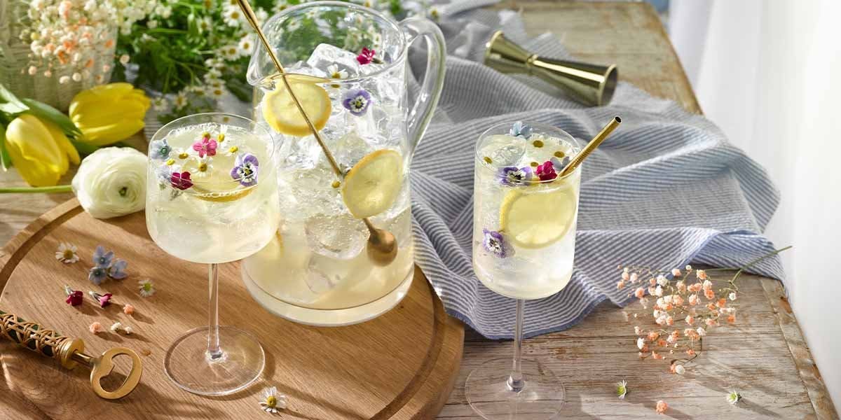 This gin, sparkling white wine and elderflower syrup punch recipe is spring in a glass - YUM!