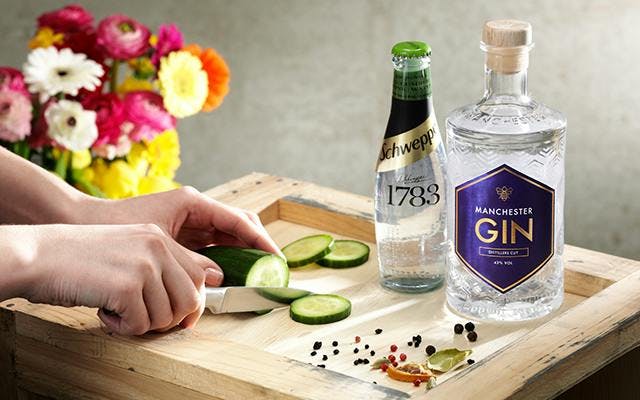 Manchester gin distillers cut with a cucumber Schweppes Tonic and cucumber