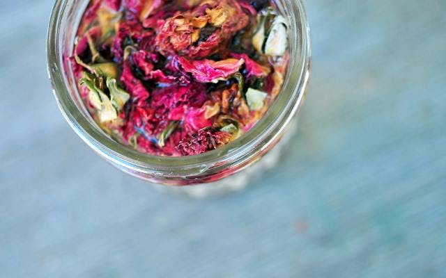Rose petal and bud infused gin in a jar