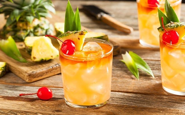 Mai Tai Golden Rum Cocktail Recipe in glass with cherry and pineapple garnish