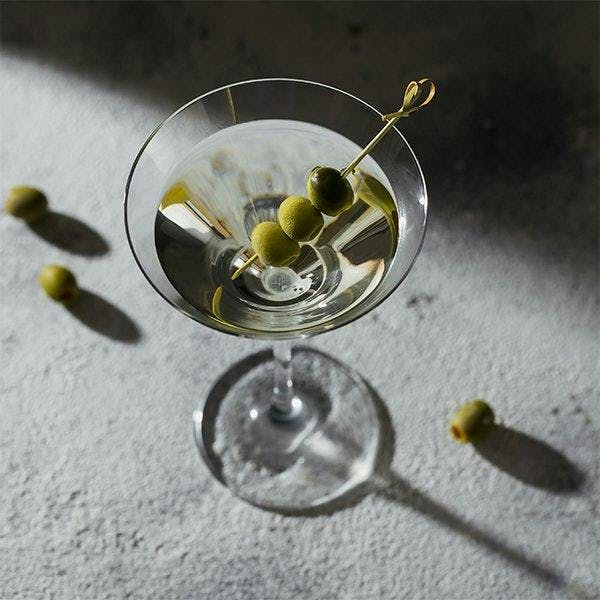 Martini cocktail with olive garnish