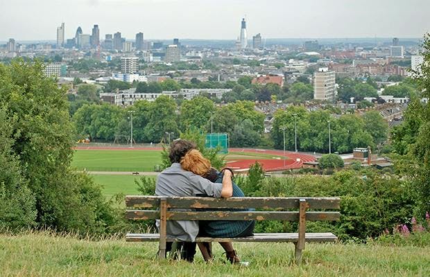 parliament hill london couple on a bench