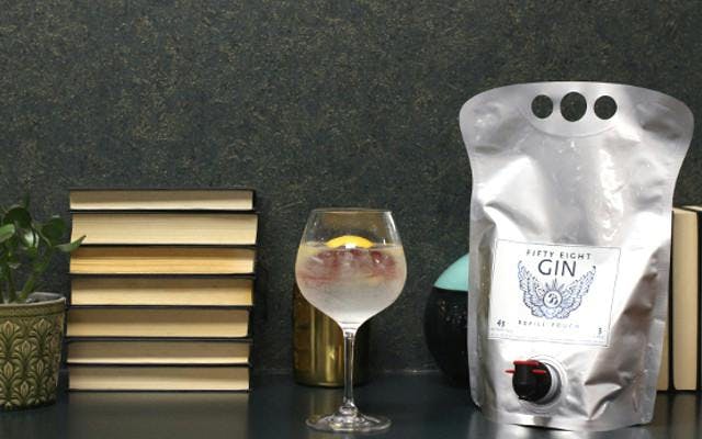 58 Gin Bag with a gin and tonic, books and plant