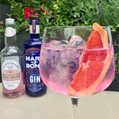 Marylebone Gin and Fentimans Pink Grapefruit Tonic Water Gin and Tonic with wedge of grapefruit over ice
