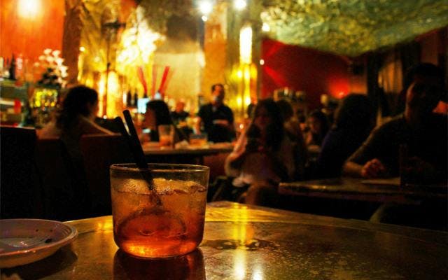 Negroni drink in backlit bar