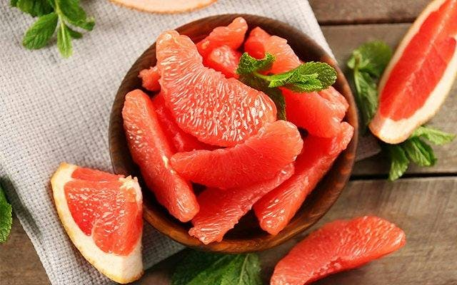 Fresh grapefruit slices with sprig of mint
