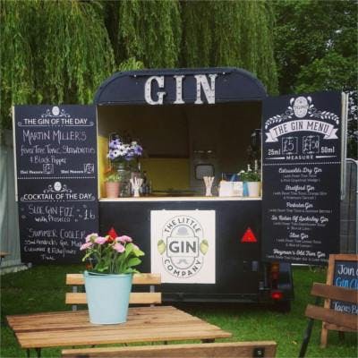 Mobile Gin Bar trailer in garden serving gin and tonics and cocktails