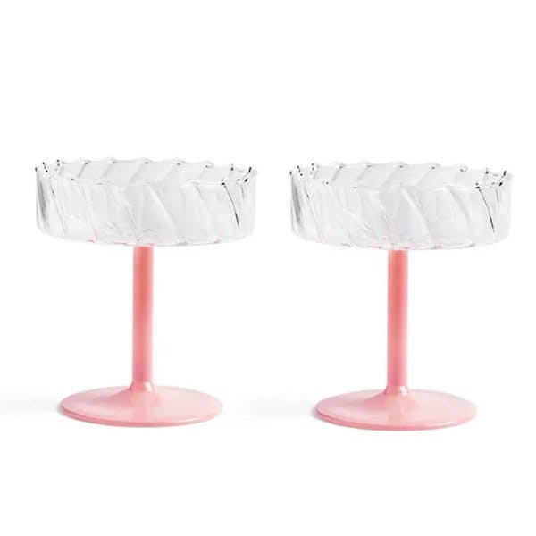 Two pink stemmed coupe glasses