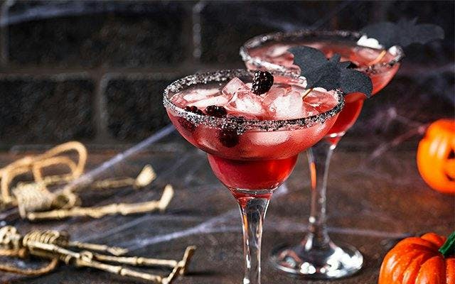 Halloween cocktail with blackberries