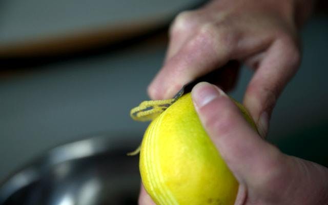 zesting a lemon for the Lighthouse gin in New Zealand