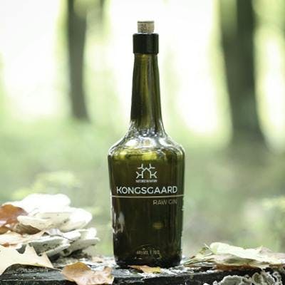 Kongsgaard Gin bottle in forest