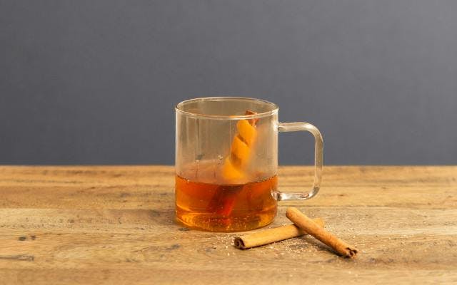 Hackney Homebrew gin cocktail with cinnamon sticks and orange peel