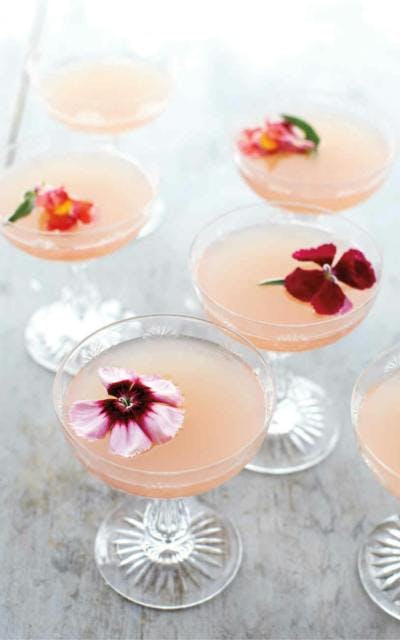 Lillet pink rose spring cocktail with edible flowers to garnish