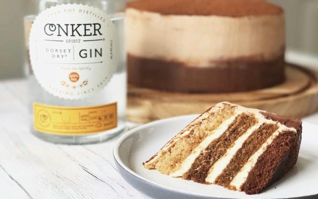 slice of Conker gin cappuccino cake and conker gin bottle