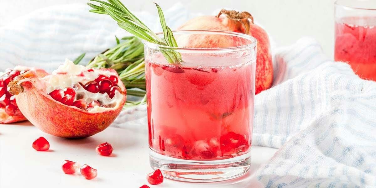 A pomegranate and rosemary gin & tonic brings festive cheer to any occasion!