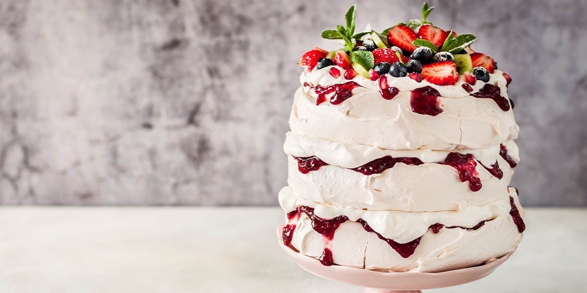 This show-stopping Orange & Cranberry Meringue Cake is simply gin-credible!